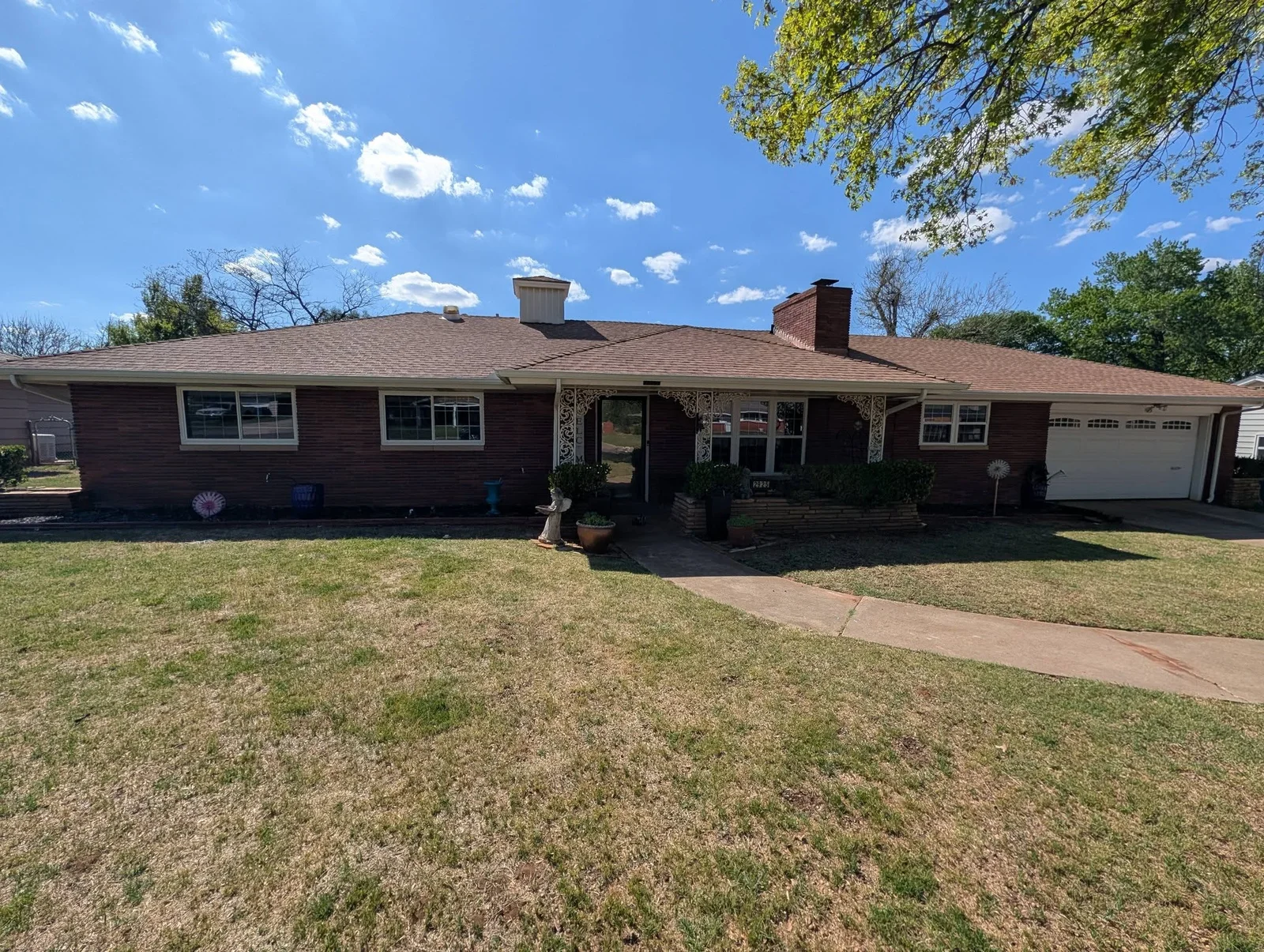 Brick ranch home with newly installed double-hung windows and updated trim